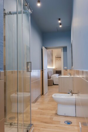 Family Suite, Balcony, City View | Bathroom | Shower, free toiletries, hair dryer, slippers - Rooftop Parthenopeo - Contemporary Rooms (Naples)