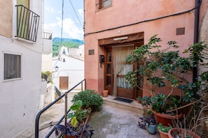A narrow alley with a building labeled 'LA GERMANDE.' - Country House 'Ca La Germandat Paüls' with Mountain View, Private Terrace and Wi-Fi (Pauls)