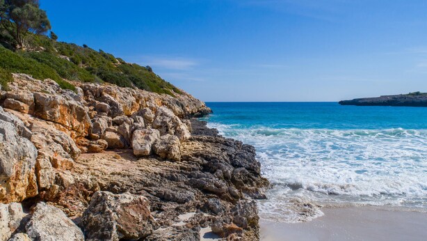 A rocky coastline with clear blue waters and a distant island. - Beautiful home in Son Macia (Son Macia)