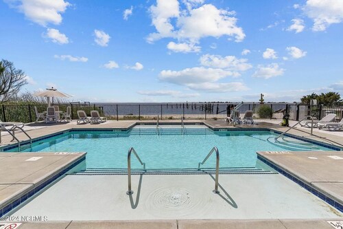 No Cleaning Fee! Brand New Double Queen Studio Condo w/ Waterfront Pool + Beach