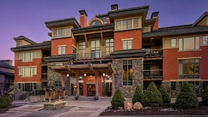 A multi-story hotel with a stone facade, large windows, and a covered entrance area. - Welcome to Your 4BR/4BA Perfect Mountain Retreat in Park City (Park City)
