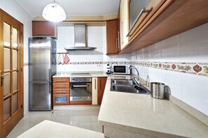 Fridge, microwave, stovetop, cookware/dishes/utensils