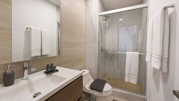 Shower, hair dryer, towels, soap
