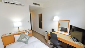 A hotel room with a bed, a desk, a chair, a TV, a lamp, and a mirror. - Aomori Forest Hotel Annex (Aomori)