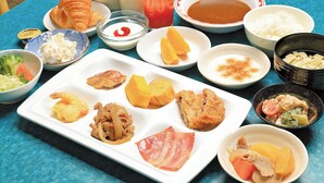 A table with various dishes including croissants, rice, and soup. - Aomori Forest Hotel Annex (Aomori)