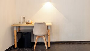 A compact workspace with a desk, chair, and a compact refrigerator. - I Remi del Prione by Le 5 Terre (La Spezia)