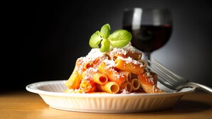 A plate of pasta with a glass of red wine. - Appartamenti Giada Two-room Apt 6 Pax Casa Giada (Moneglia)