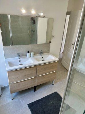 Shower, hair dryer, towels, soap