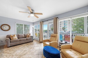 Signature Condo, 2 Bedrooms, Balcony | Living room | 52-inch Smart TV with digital channels