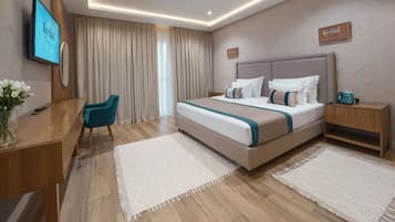 Quarto superior, 1 cama King | Roupas de cama premium, frigobar, cofres nos quartos, escrivaninha