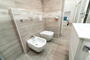 Apartment | Bathroom | Shower, hair dryer, bidet, towels - Modern Apartment at Via Carloni by Wonderful Italy (Como)
