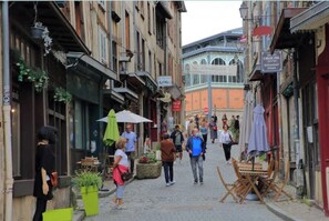 Walking through historic streets lined with traditional buildings.