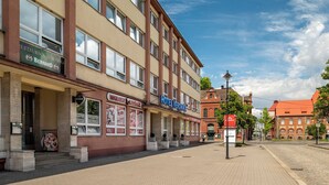 A hotel with a sign reading "HOTEL VERONIKA" on a building with multiple windows and a red roof. - Hotel Veronika (Ostrava)