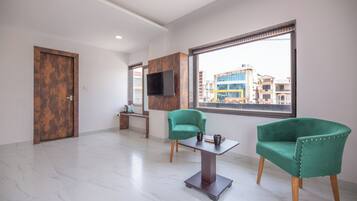 Premium Double Room, City View | Living area | 40-inch LED TV with satellite channels, fireplace, Netflix