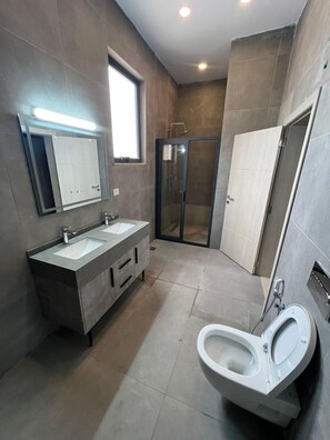 Exclusive Suite | Bathroom | Hair dryer, bathrobes, towels
