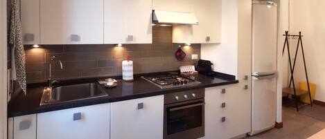 Fridge, microwave, stovetop, coffee/tea maker