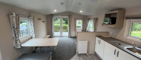 Cabin | Private kitchen | Fridge, microwave, oven, stovetop