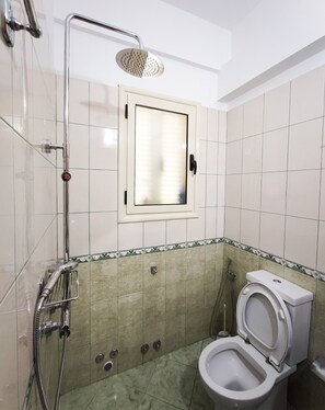 Shower, hair dryer, towels, soap
