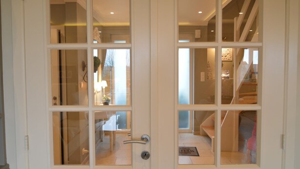 A double door with frosted glass panels, a visible interior with a staircase, and a doormat on the floor. - Forestside Retreat, Malmedy (Malmedy)