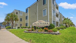 A multi-story building with a sign reading "Marsh Villas 4801."