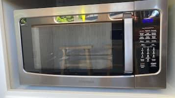 A Toshiba microwave oven with a digital display and multiple cooking settings.