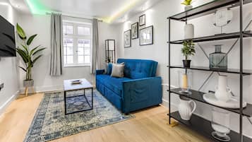 Comfort Apartment, 1 Bedroom, Private Bathroom, City View | Living area | 50-inch Smart TV with digital channels, Netflix, streaming services