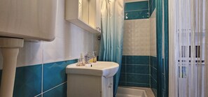 Hair dryer, towels, soap, toilet paper