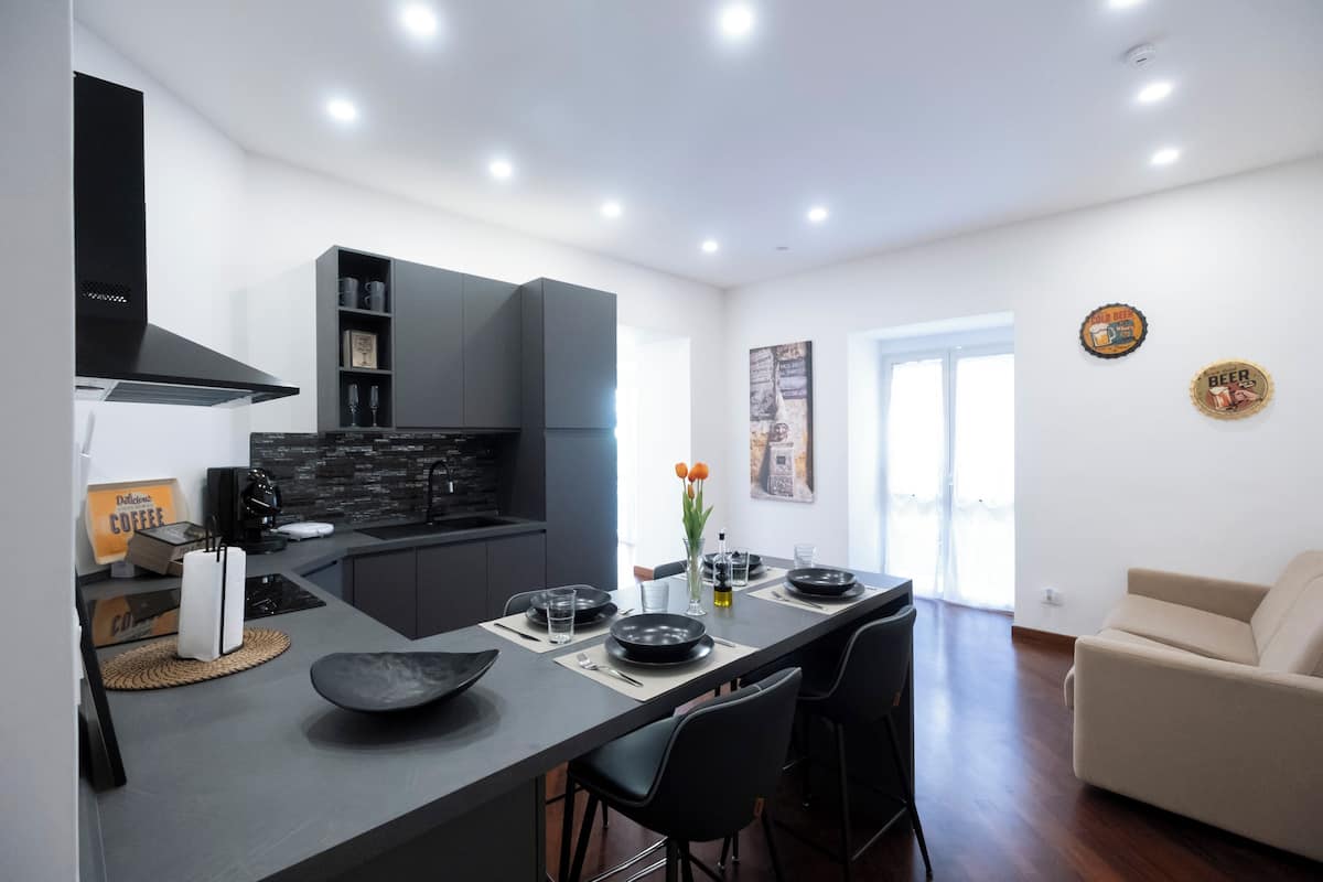 Family Suite, Balcony, City View | Private kitchen | Espresso maker, electric kettle, cleaning supplies, dining tables