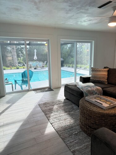 Waterfront Retreat 4 BR, 3 BA screened & heated pool, gorgeous canal views