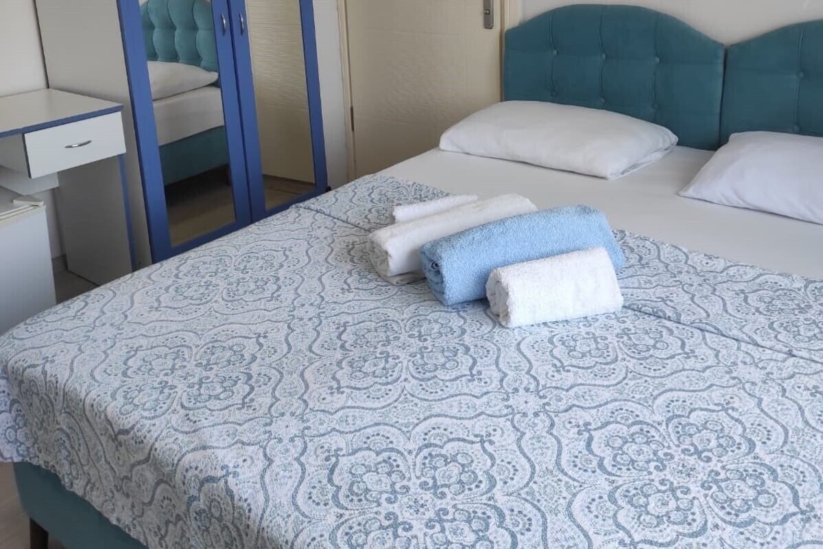 Minibar, desk, laptop workspace, bed sheets