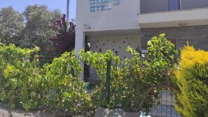 A building with a sign reading "OTEL" and a modern architectural style. - Otuz5 Otel (Cesme)