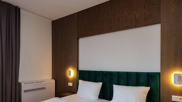 Hochwertige Bettwaren, Daunenbettdecken, Minibar, Zimmersafe