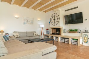 TV, fireplace - Villa Binimigi - Four Bedroom Villa, Sleeps 8 (Binisafua)