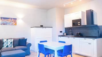 Apartment | Private kitchen | Full-size fridge, microwave, dishwasher, electric kettle