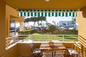 Enjoy the view from this balcony with a bathtub and outdoor seating area.