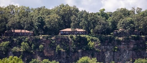 A cliffside property with multiple buildings.