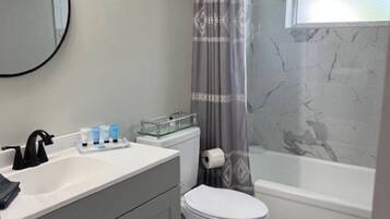 Shower, hair dryer, towels, soap