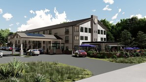 A hotel with a covered parking area, a restaurant with outdoor seating, and a landscaped garden. - The Wave at Marblehead (Marblehead)