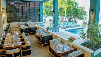 Breakfast, lunch, dinner served; pool views
