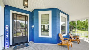A blue exterior with a white door, two wooden chairs, and a welcome sign. - Pet-Friendly Lancaster Home 13 Mi to Dtwn Buffalo (Lancaster)
