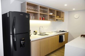 Fridge, microwave, stovetop, coffee/tea maker