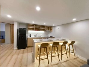 Fridge, microwave, stovetop, coffee/tea maker