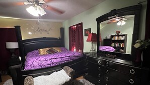 A bedroom with a bed, dresser, and a mirror. - Colorful spacious 3 bedroom house near center  (Philadelphia)