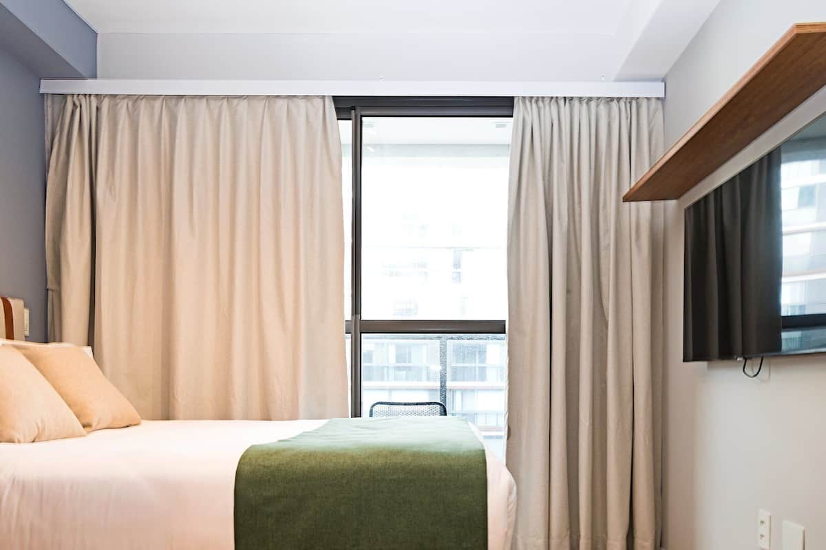 1 bedroom, laptop workspace, blackout drapes, iron/ironing board