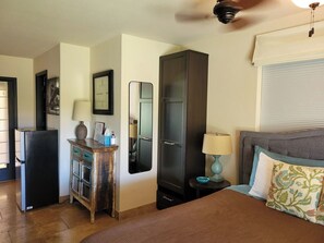 A bedroom with a bed, a dresser, a mirror, a lamp, and a ceiling fan. - Cozy Guest Suite with Private Backyard (Mesa)