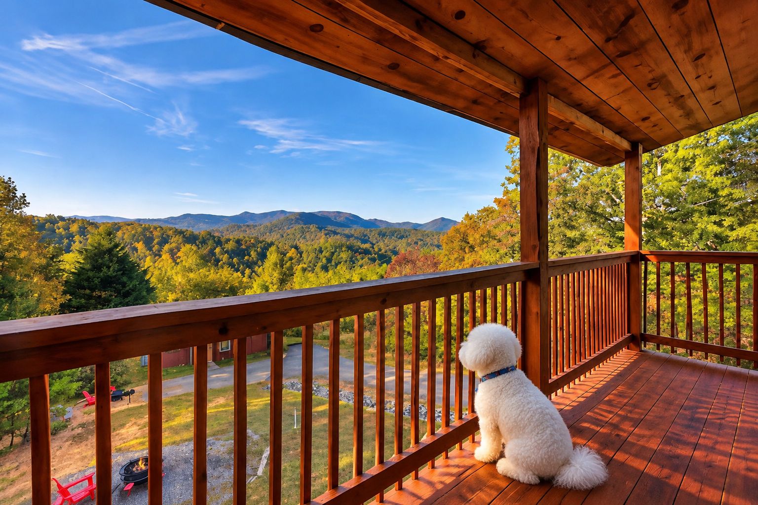 A wooden deck with a dog sitting on it, overlooking a forested landscape with mountains in the distance.