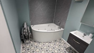 Jetted bath, hair dryer, towels, soap