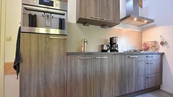 Microwave, stovetop, coffee/tea maker, electric kettle