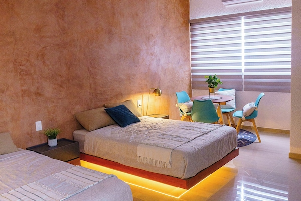 Executive Quadruple Room | Premium bedding, down comforters, individually decorated, desk