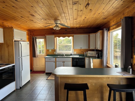 Fridge, microwave, oven, stovetop. Close to Beach and Town of Souris. Quaint cottage with lovely log cabin feel.